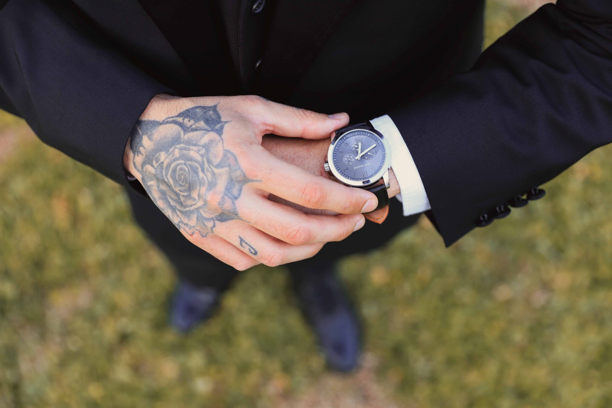 groom hands low